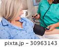 Senior Woman Hospital Blood Pressure Check  30963143