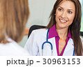 Woman Doctor in Hospital Meeting with Colleague 30963153