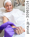 Plastic Surgeon Doctor Marks Hand of Senior Woman 30963154