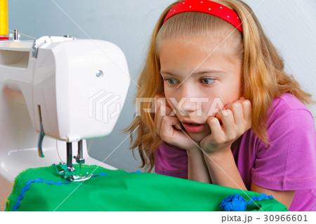 Teen girl frightened by her mistake when sewing 30966601