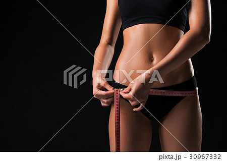 The fit woman measuring perfect shape of beautiful 30967332
