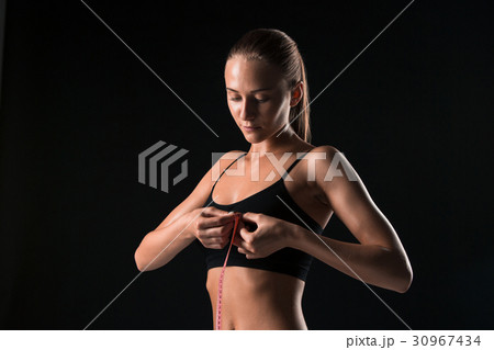 The fit woman measuring perfect shape of beautiful 30967434