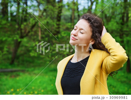 beautiful young woman in the park beautiful young woman in the park 30969981