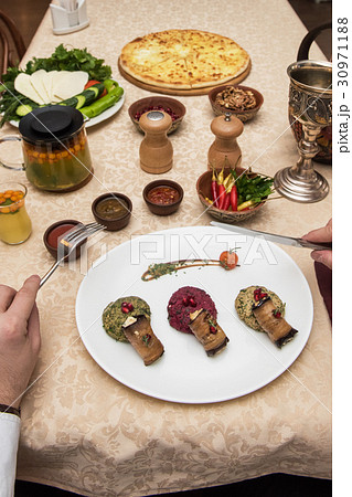 Man eating in georgian restaurant 30971188
