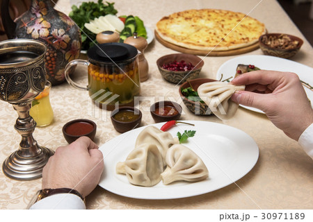 Man eating in georgian restaurant 30971189