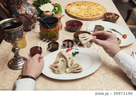 Man eating in georgian restaurant 30971190