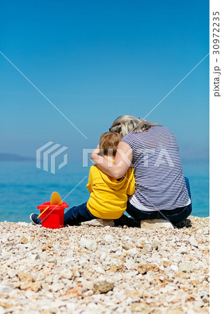 A happy mother and young child boy son having fun 30972235