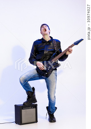 expressive handsome rock musician playing 30974027