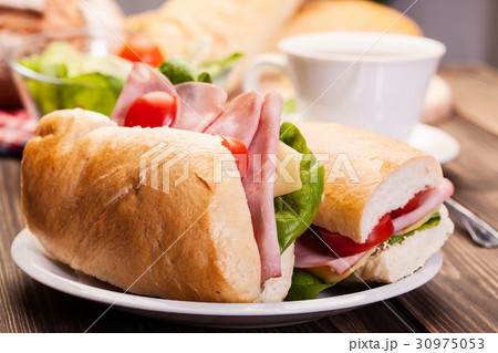 Panini sandwich with ham, cheese and tomato 30975053