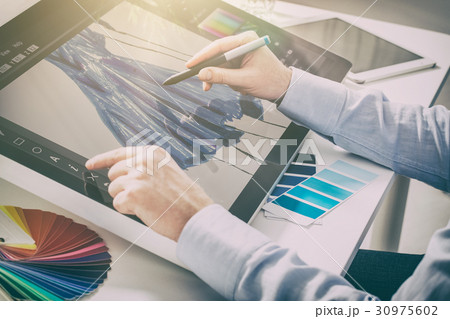 Graphic designer at work. Color samples. 30975602