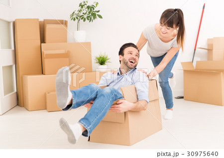Young people move into a new apartment. Young people move into a new apartment. 30975640