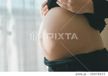 woman during pregnancy or shortly after childbirth woman during pregnancy or shortly after childbirth 30976625