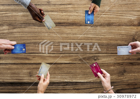 Group of hands holding credit card convenience life with copy space in aerial view 30978972