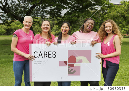 Group of women holding banner of charity donations campaign Group of women holding banner of charity donations campaign 30980353