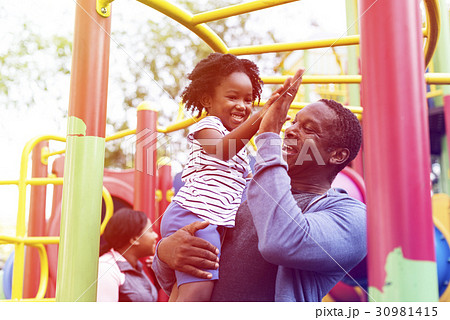 Happiness family holiday at playgorund Happiness family holiday at playgorund 30981415