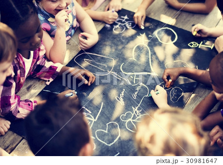 Group of children drawing on blackboard 30981647