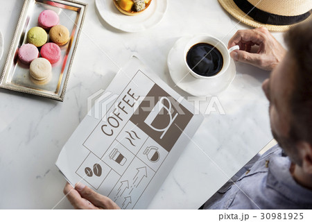 Man drinking coffee with Illustration of coffee shop advertisement on newspaper 30981925