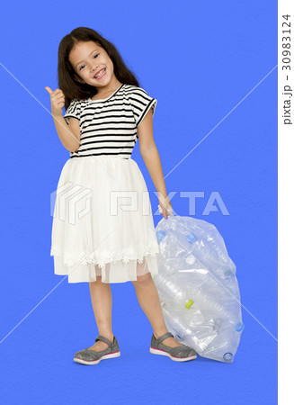 Little Girl Holding Separate Plastic Bottles Studio Portrait 30983124