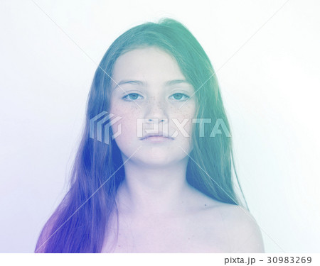 Girl standing with a poker face 30983269