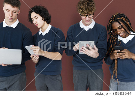 Group of Diverse High School Students Using Digital Devices Studio Portrait Group of Diverse High School Students Using Digital Devices Studio Portrait 30983644