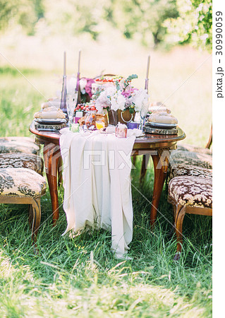 The close-up photo of the wedding setting table 30990059