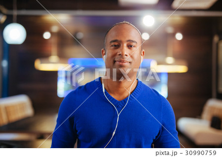 attractive man in headphones listening music attractive man in headphones listening music 30990759