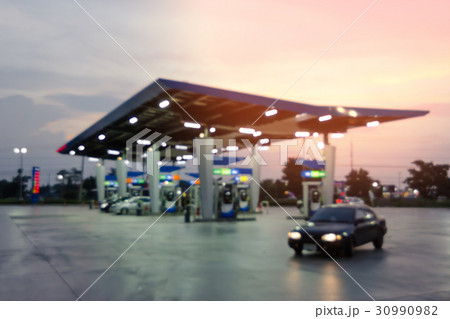twilight fueling station,Out of focus background twilight fueling station,Out of focus background 30990982