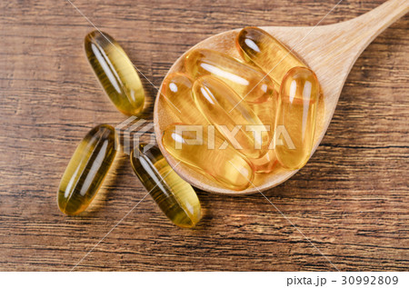 Fish oil capsules with omega 3 and vitamin D. 30992809