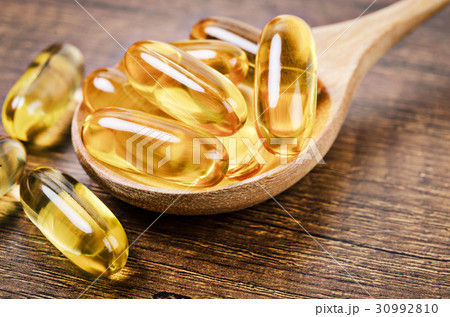 Fish oil capsules with omega 3 and vitamin D. 30992810