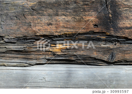 Wall made of wooden logs 30993597