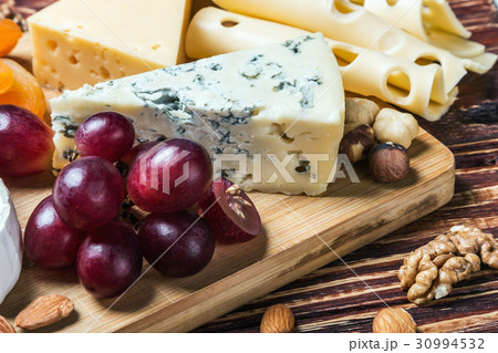 Assorted fresh cheese, fruits and nuts Assorted fresh cheese, fruits and nuts 30994532