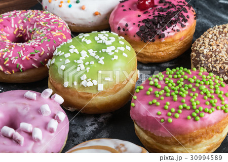 Glazed donuts with different fillings 30994589