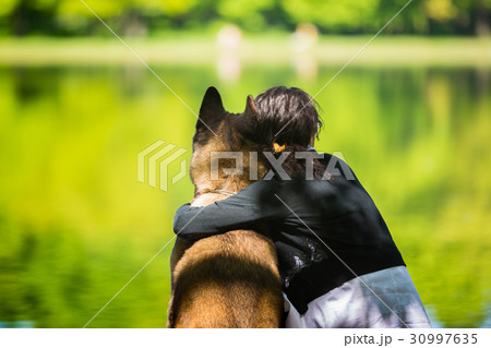Woman with an American Akita dog 30997635