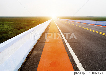 Empty road and the red traffic lines. 31002174