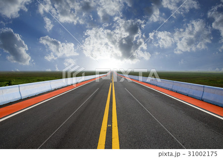 Empty road and the yellow traffic lines 31002175