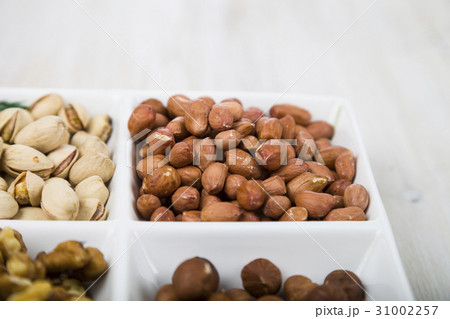 Nuts in a plate   Nuts in a plate   31002257