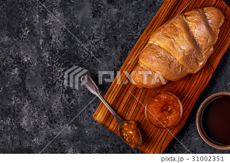 Fresh croissant on dark background. 31002351