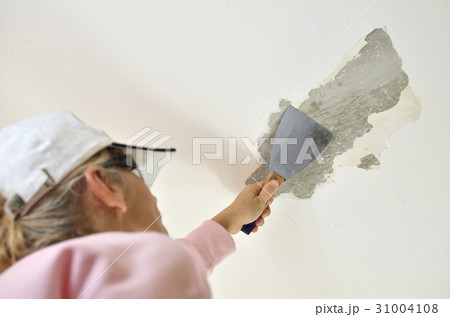 Woman with Scraping Tool 31004108
