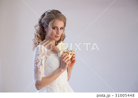 bride in wedding dress holding a chocolate bride in wedding dress holding a chocolate 31005448
