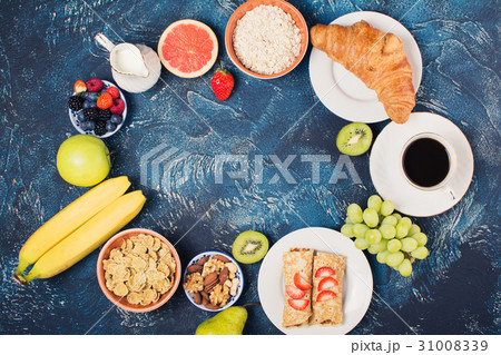 Breakfast with pancakes, fruits, nuts, coffee 31008339