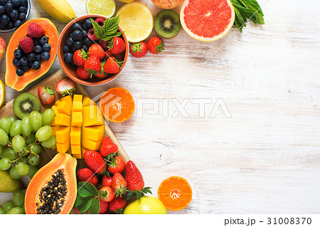 Rainbow fruits top view on white 31008370