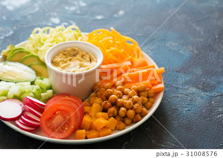 Healthy cut vegetables on the blue table Healthy cut vegetables on the blue table 31008576