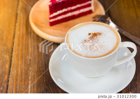 A cup of coffee and a piece of cake. A cup of coffee and a piece of cake. 31012300