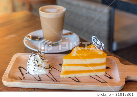 A cup of coffee and a piece of cake. A cup of coffee and a piece of cake. 31012301