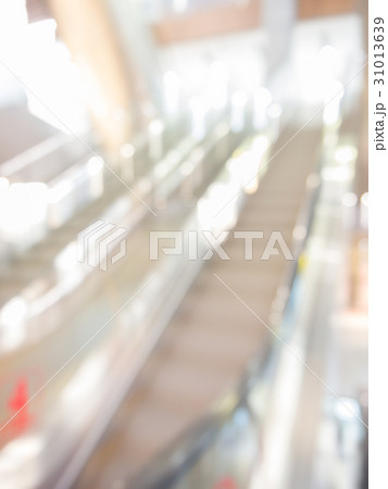 blurred escalator in shopping mall background blurred escalator in shopping mall background 31013639