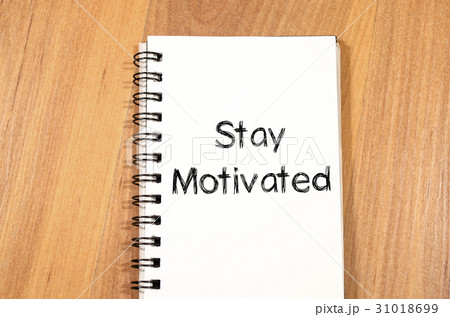 Stay motivated write on notebook Stay motivated write on notebook 31018699