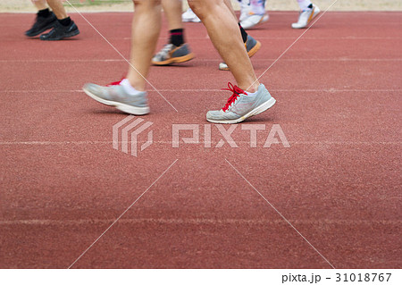 Group of walking and runners on racetrack Group of walking and runners on racetrack 31018767