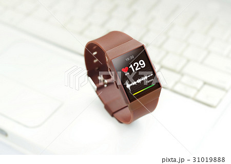 Heart rate on smartwatch screen,on keyboard laptop 31019888
