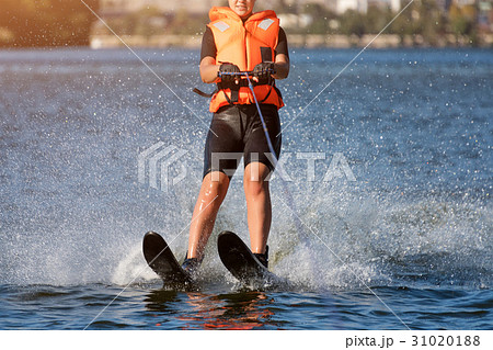 Woman riding water skis closeup. Body parts 31020188