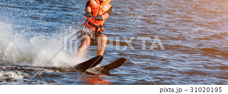 Woman riding water skis closeup. Body parts 31020195